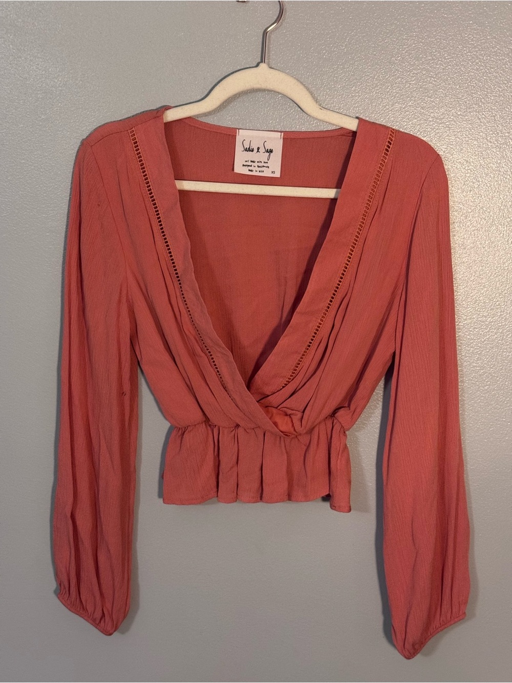 Sadie & Sage Coral Wrap Peplum Crop Blouse | Dry Goods